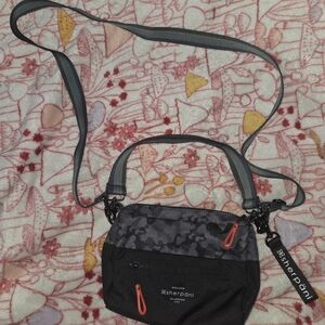 Sherpani Black and Gray Crossbody Bag with Orange Accents